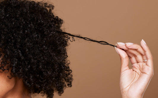 The Hidden Culprit Behind Frizzy, Tangled Curls: Hard Water